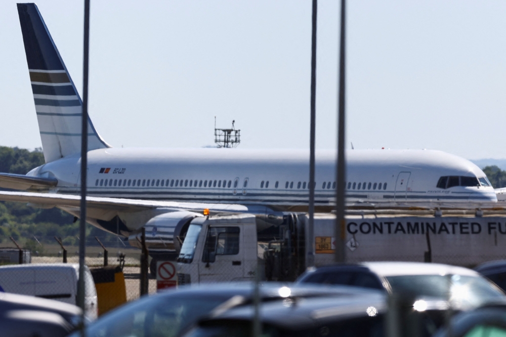 A plane reported by British media to be first to transport migrants to Rwanda is seen on the tarmac at MOD Boscombe Down base in Wiltshire June 14, 2022. Britain and Rwanda crossed swords at an international court today, with Kigali seeking more than £100 million (RM523 million) it says London still owes from a scrapped deal to deport migrants. — Reuters pic