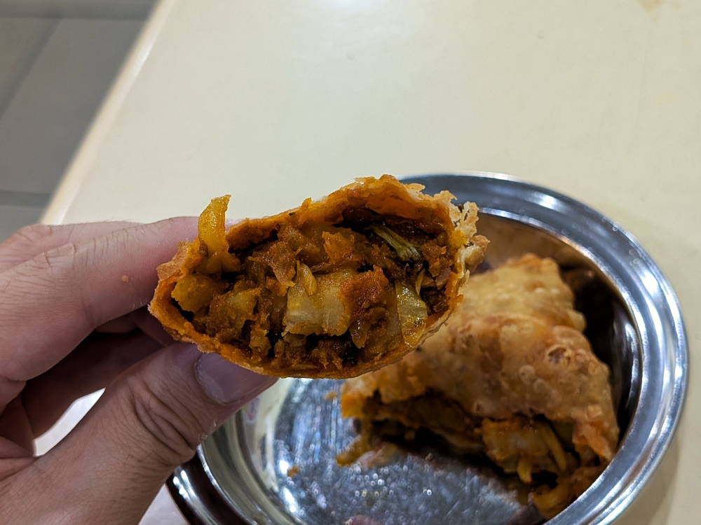 It’s only a curry puff, but it is truly one of the most satisfying specimens you’ll find. — Picture by Ethan Lau
