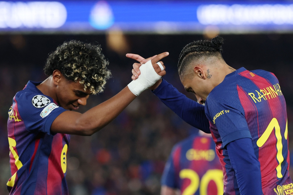 Barcelona's Brazilian Raphinha celebrates scoring his team's seventh goal with Spanish forward Lamine Yamal (L). — AFP pic