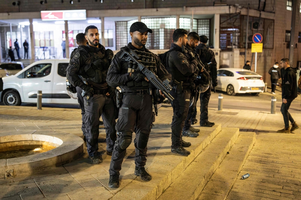 Israeli security stand guard outside the old city walls of Jerusalem on March 17, 2026, as they attempt to stop Muslim worshippers from approaching to perform the nightly Tarawih prayers during the Muslim holy month of Ramadan while the Aqsa mosque compound remains closed. — AFP pic