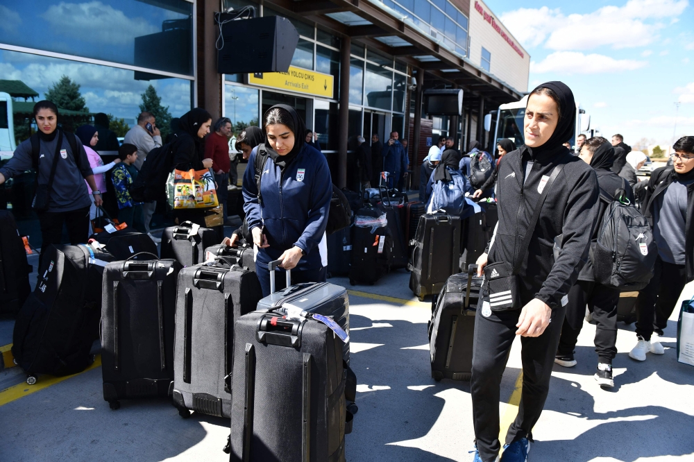 Members of Iran's women's football team exit Igdir airport, waiting to reach Dogubeyazit, in Igdir on March 18, 2026. — AFP pic