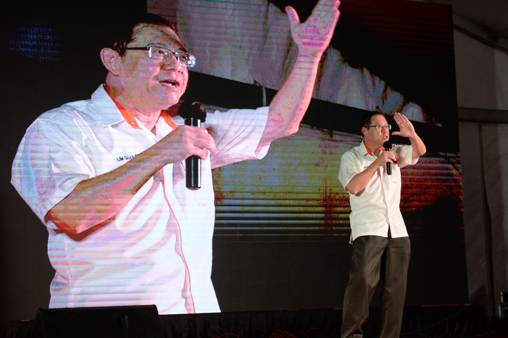 Lim Guan Eng speaks during a campaign rally at Karpal Singh Drive in Penang on August 11, 2023. — Picture by KE Ooi