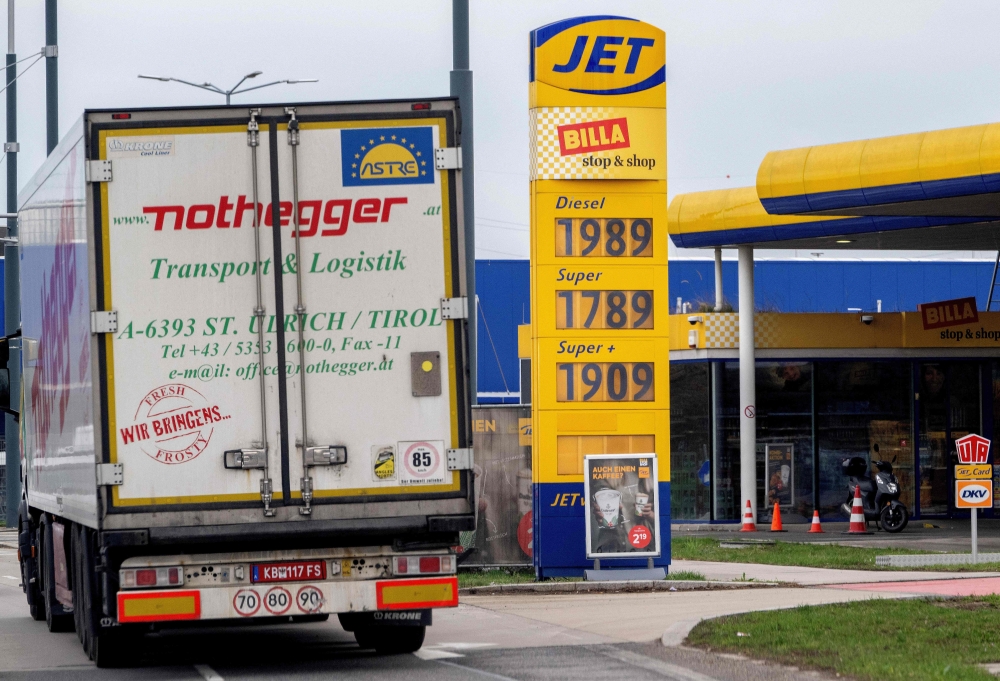 A truck drives past a sign displaying the prices of a petrol and diesel at a petrol station in Deutsch-Wagram, north-east of Vienna, Austria on March 16, 2026. The European Commission is instructing governments to be flexible when enforcing EU rules on gas imports, ⁠given concerns that strict compliance could delay LNG deliveries needed to stabilise supplies. — AFP pic 