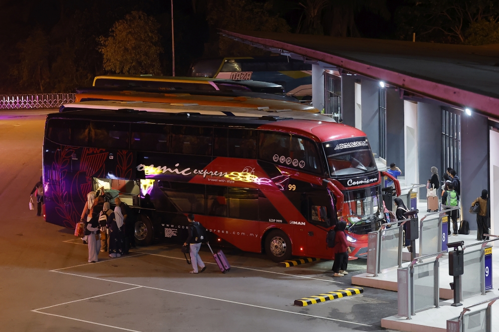 People board a bus to return to their hometowns to celebrate Hari Raya Aidilfitri, during a Bernama photo tour at Putrajaya Sentral March 17, 2026. — Bernama pic