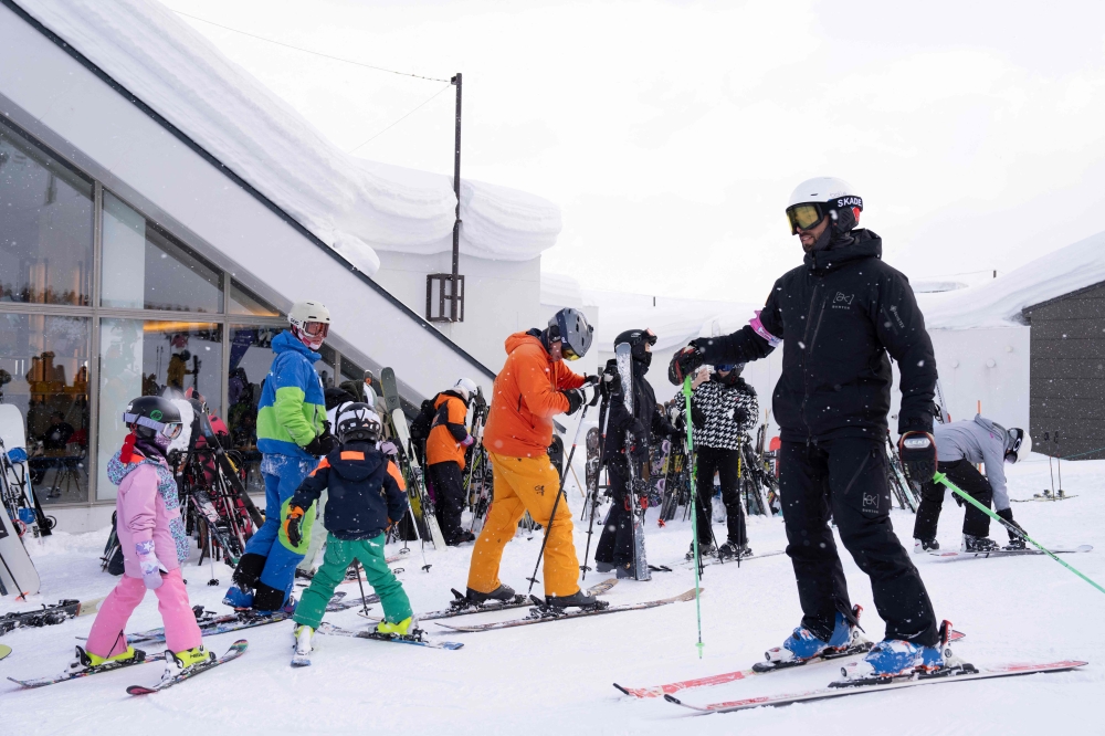 This picture taken on February 19, 2026 shows foreign tourists preparing to ski at the Niseko Tokyu Grand Hirafu ski resort in Kutchan, Hokkaido prefecture.  — AFP pic 