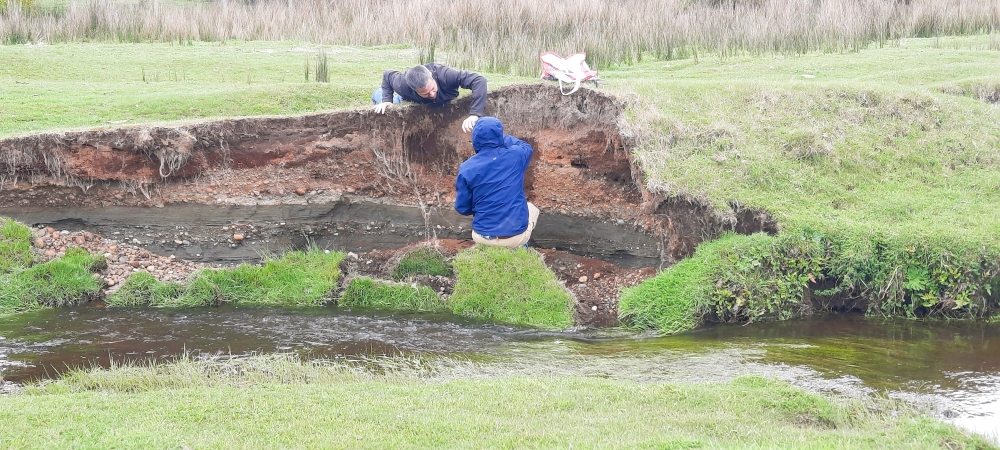 Researchers Todd Surovell and Juan Luis Garcia examine the bank of the Chinchihuapi Creek near the Monte Verde archaeological site in southern Peru, in this 2023 photograph released on March 18, 2026. — Claudio Latorre pic via Reuters