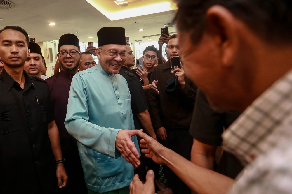 Prime Minister Datuk Seri Anwar Ibrahim has urged the people to celebrate Aidilfitri in moderation and to be more mindful of the plight of those who are suffering, as the world faces geopolitical turmoil, especially in West Asia. — Picture by Sayuti Zainudin 