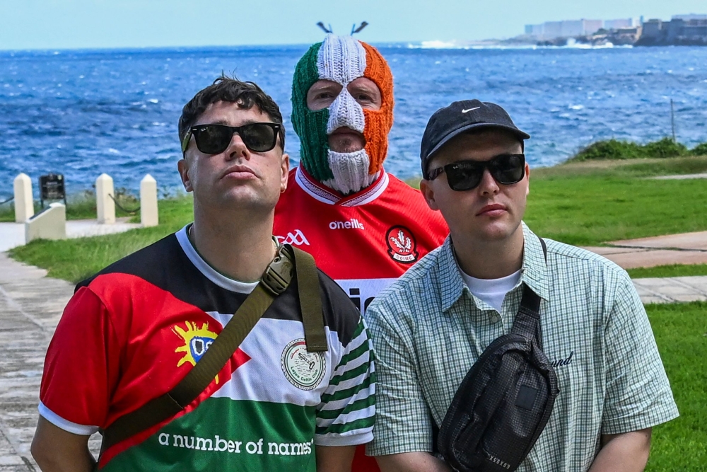 The members of the Irish-language rap trio Kneecap said Friday that they joined an international aid convoy to Cuba because they could not stay silent while the island was being ‘strangled’. — AFP pic