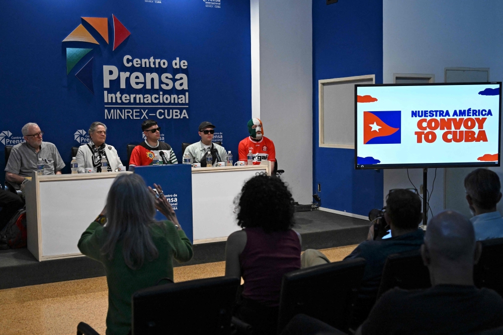(L-R) Jeremy Corbyn, Member of Parliament of the United Kingdom, Colombia’s Senator Clara Lopez, Moglai Bap, Mo Chara and DJ Provai, members of the Irish band Kneecap, attend a press conference at the International Press Centre in Havana on March 20, 2026. — AFP pic