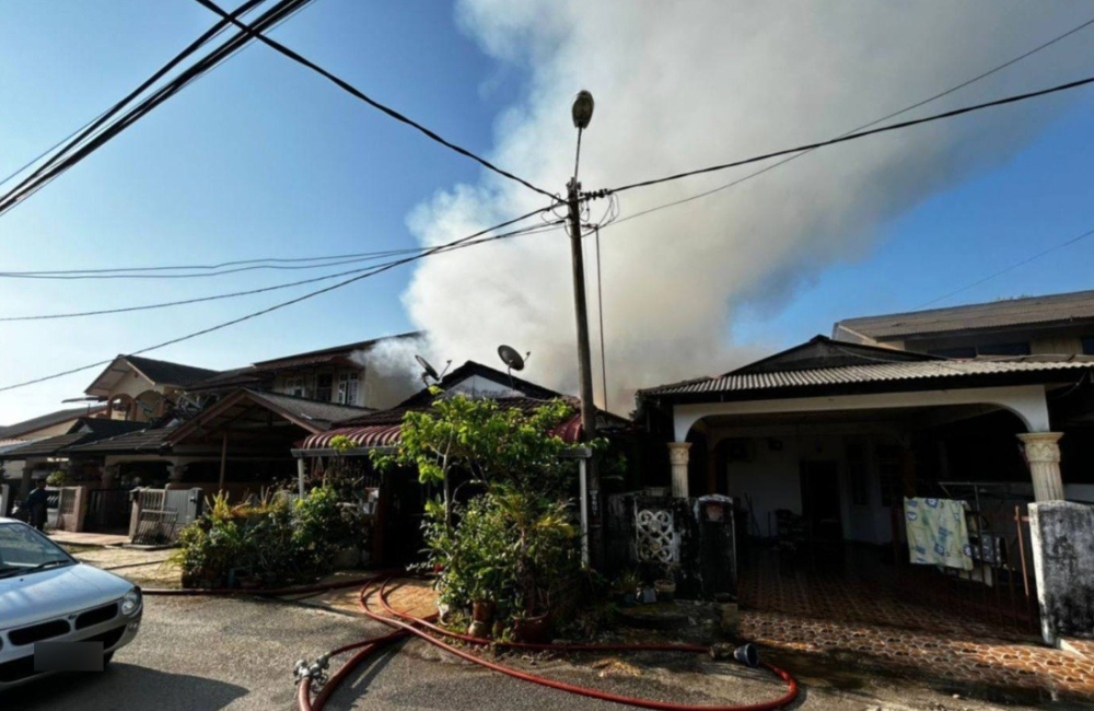 Three houses were destroyed in a fire at Kampung Bunut Payong in Kota Bharu March 21, 2026. — Picture courtesy of Fire and Rescue Department 