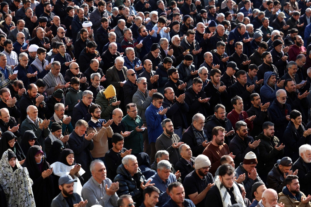 Iranian Shias take part in Eid al-Fitr prayers, marking the end of the Muslim holy month of Ramadan, at the Grand Mosalla mosque in Tehran. — AFP pic