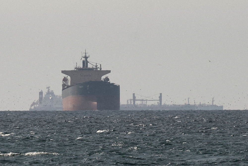Cargo ships in the Gulf, near the Strait of Hormuz, as seen from northern Ras al-Khaimah, near the border with Oman’s Musandam governance, amid the US-Israeli conflict with Iran, in United Arab Emirates, March 11, 2026. US President Donald Trump yesterday threatened to ‘obliterate’ Iran’s power plants if Tehran does not fully reopen the Strait of Hormuz within 48 hours. — Reuters pic 