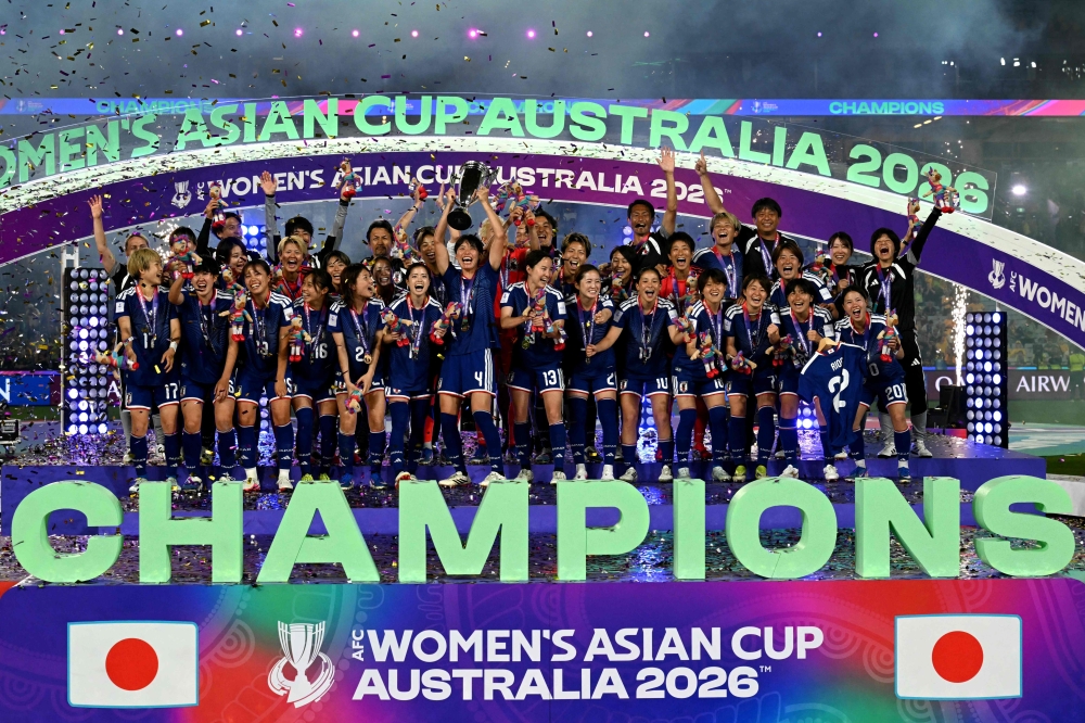Japan's team celebrate with the trophy after winning the final of the AFC Women’s Asian Cup Australia 2026 football tournament between Australia and Japan at Stadium Australia in Sydney on March 21, 2026. — AFP pic 