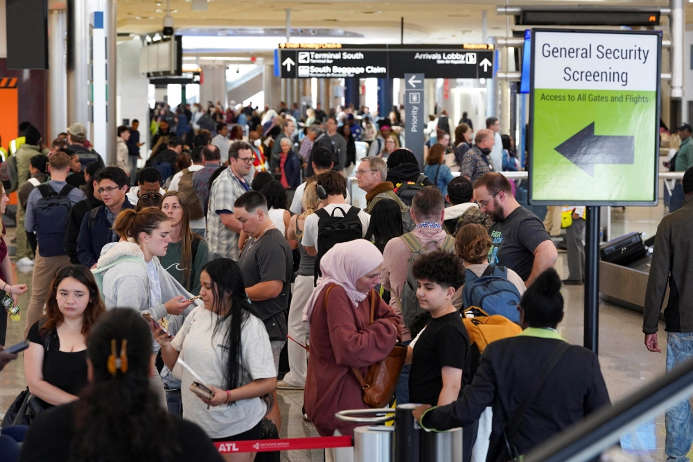 Passengers wait in long TSA lines as a partial government shutdown continues, at Hartsfield-Jackson Atlanta International Airport in Atlanta, Georgia March 20, 2026. — Reuters pic  