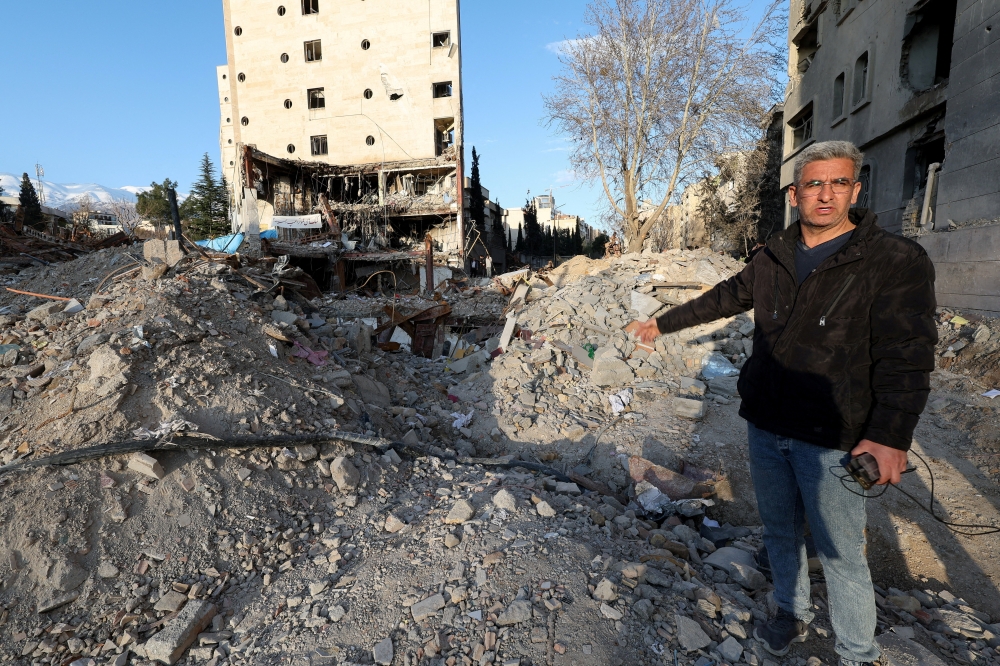 Khalil Mirzahosseini, whose brother Mahdi is missing, gestures during an interview with Reuters at the site of a destroyed building that was damaged by a strike, amid the US-Israeli conflict with Iran, in Tehran March 21, 2026. — Reuters pic  