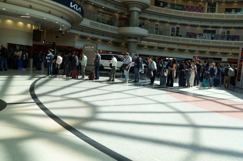 Passengers wait in long TSA lines as a partial government shutdown continues, at Hartsfield-Jackson Atlanta International Airport in Atlanta, Georgia March 20, 2026. — Reuters pic
