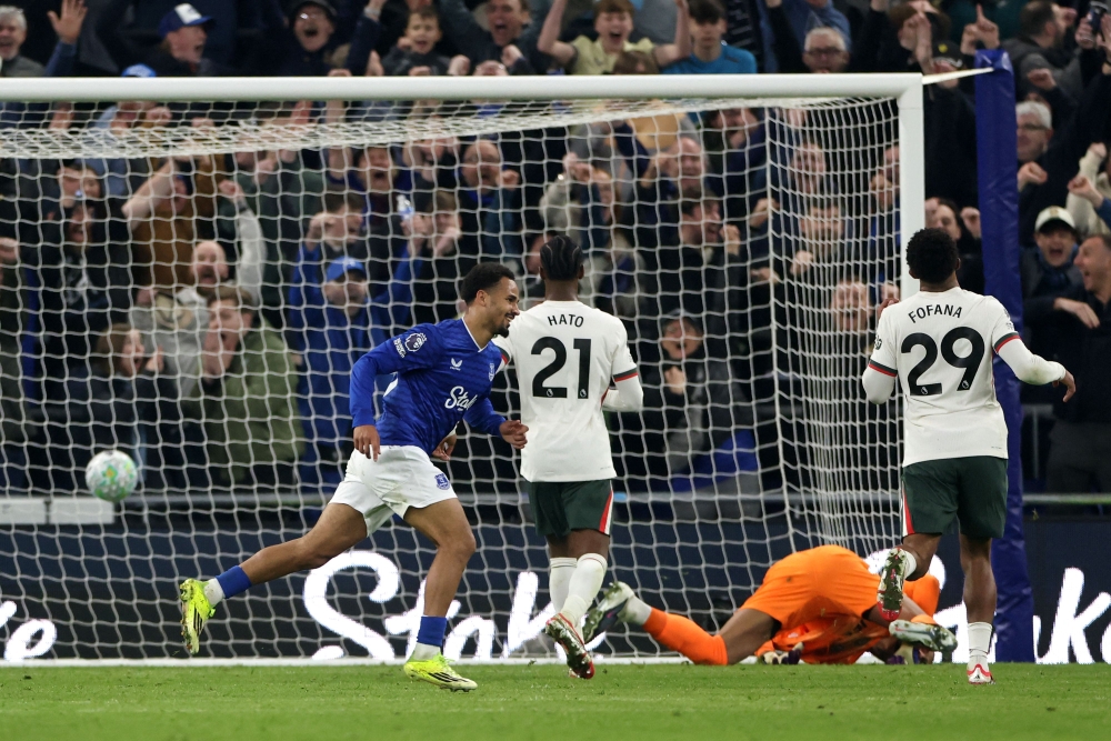 Everton's Senegalese striker #10 Iliman Ndiaye celebrates scoring the team's third goal during the English Premier League football match between Everton and Chelsea at the Hill Dickinson Stadium in Liverpool March 21, 2026. 