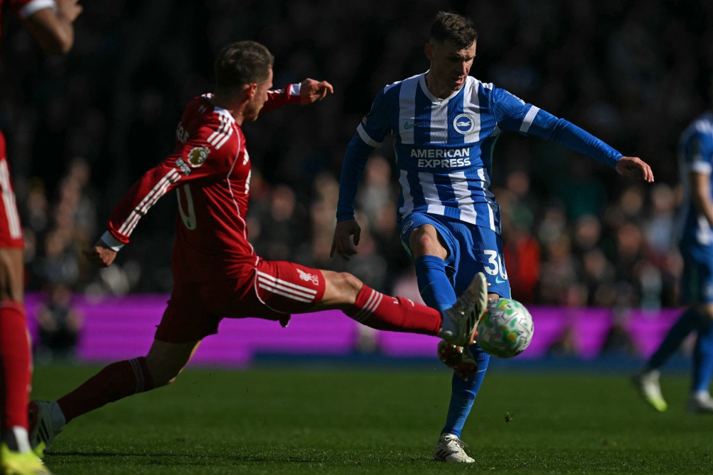 Liverpool's Argentinian midfielder #10 Alexis Mac Allister (left) challenges Brighton's German midfielder #30 Pascal Gross (right) during the English Premier League football match between Brighton and Hove Albion and Liverpool at the American Express Community Stadium in Brighton March 21, 2026. — AFP pic 