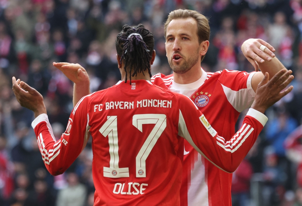 Bayern Munich's French midfielder #17 Michael Olise celebrates his 1-0 with Bayern Munich's English forward #09 Harry Kane during the German first division Bundesliga football match between FC Bayern Munich and Union Berlin in Munich March 21, 2026. — AFP pic