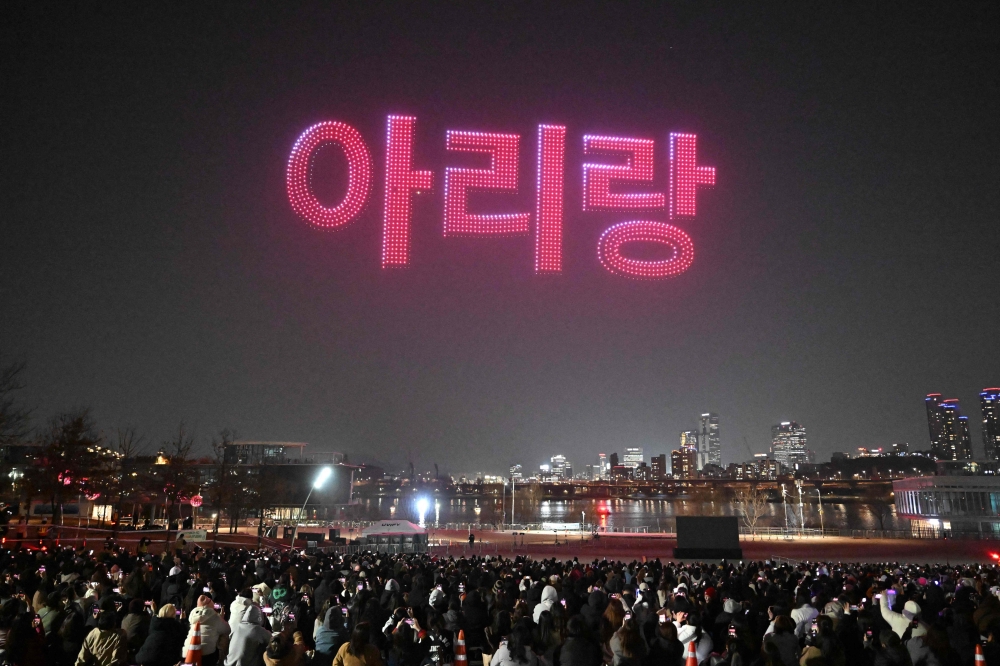 Drones illuminate the night sky with the Korean characters for BTS’ new album ‘Arirang’ during a drone light show at a riverside park in Seoul on March 20, 2026, ahead of the comeback concert of K-pop boy band — AFP pic