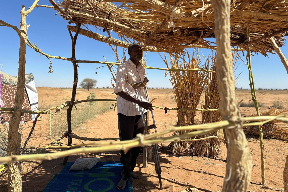 Sudanese displaced Ibrahim Noureldin, who says he was imprisoned and tortured in Rapid Support Forces’ (RSF) prisons before fleeing El-Fasher, leans on crutches at a makeshift shelter in the town of Tawila, in war-torn Sudan’s western Darfur region on March 2, 2026. — AFP pic