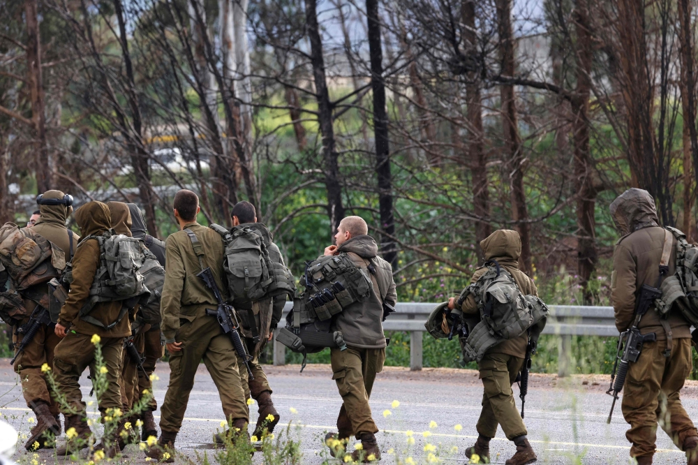 Israeli soldiers seen in the Upper Galilee in northern Israel near the Lebanon border on March 22, 2026. — AFP pic