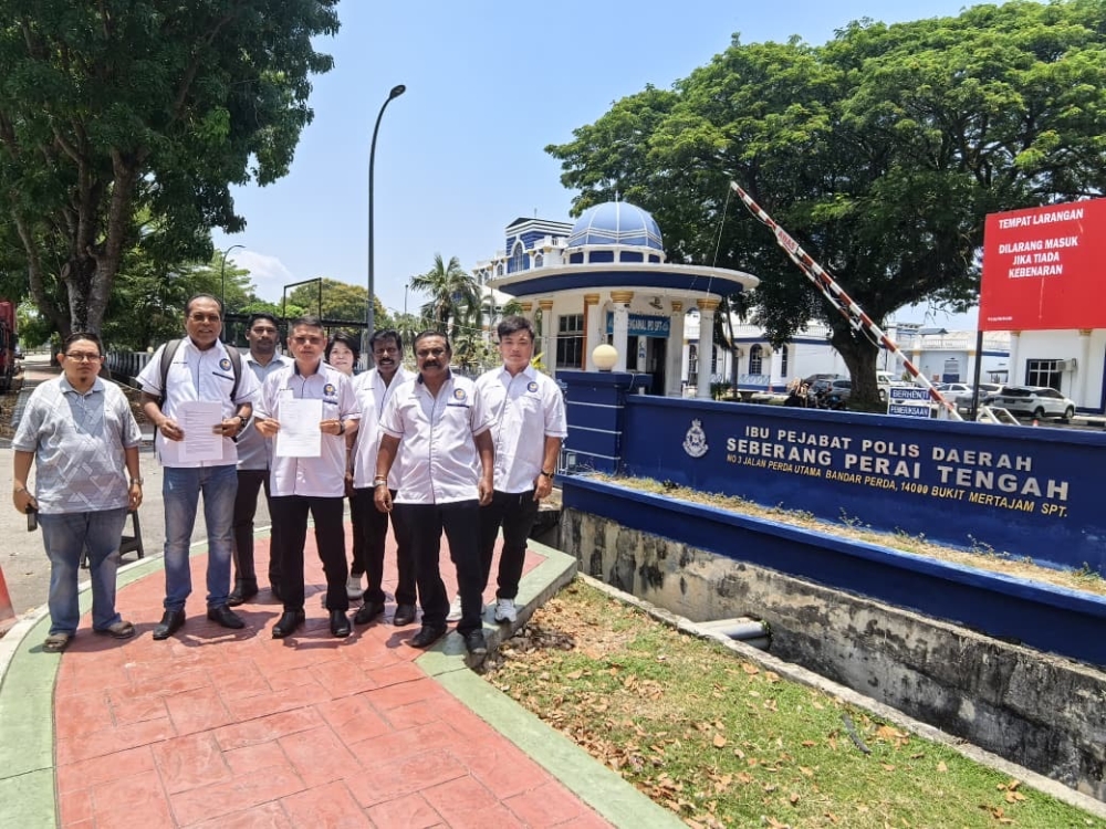 Bukit Mertajam Hospital’s Board of Visitors spokesperson Ng Yi Cheah (centre) with the police report. — Pic courtesy of Ng Yi Cheah