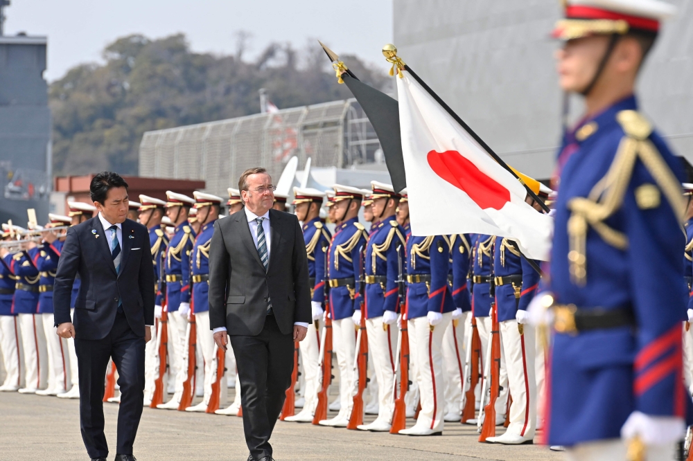 German Defence Minister Boris Pistorius and Japan’s Defence Minister Shinjiro Koizumi inspect the honour guard during a welcome ceremony at the Japan Maritime Self-Defence Force (JMSDF)’s naval base in Yokosuka, south of Tokyo on March 22, 2026. — AFP pic