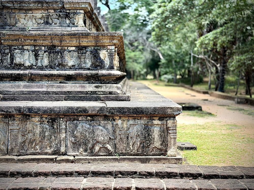 Cycling through the archaeological park beneath tall tamarind trees, you move from monument to monument as though turning pages in a stone history book, says the writer.
