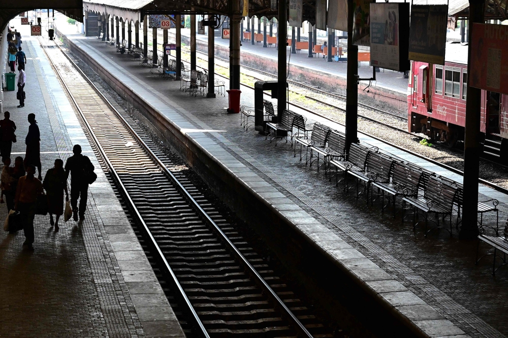 People walk at the deserted Fort Railway Station in Colombo on March 18, 2026, after Sri Lanka announced a shorter work week to conserve its scarce fuel reserves as it prepares for a prolonged war in the Middle East. — AFP pic
