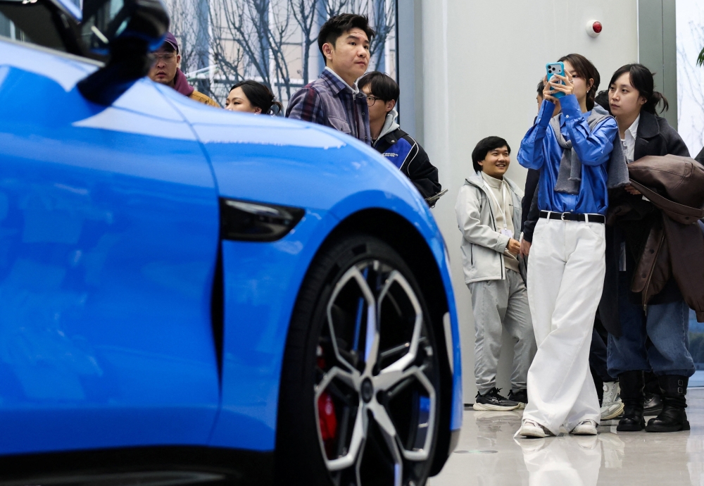 The company’s electric vehicle business helped drive overall revenue growth despite headwinds. — Reuters pic