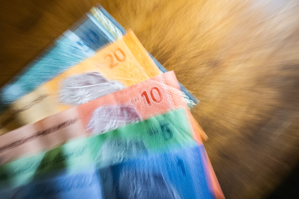 Malaysia’s ringgit got a boost as investors reacted to signs of potential de-escalation in the Iran conflict. — Picture by Firdaus Latif