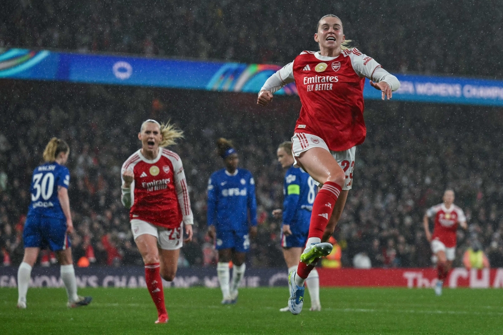Arsenal’s Alessia Russo (right) celebrates after scoring her team’s third goal during the Uefa Women’s Champions League quarter-final first leg match with Chelsea at The Emirates Stadium in London March 24, 2026. — AFP pic