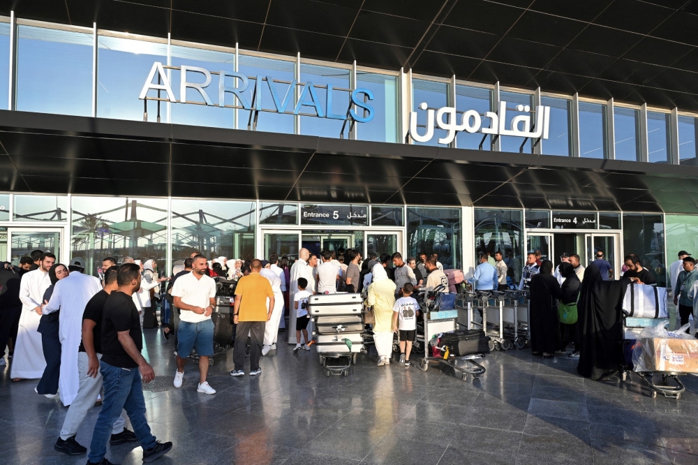 A drone attack hit a fuel tank at Kuwait International Airport, triggering a fire but causing no casualties. — AFP pic
