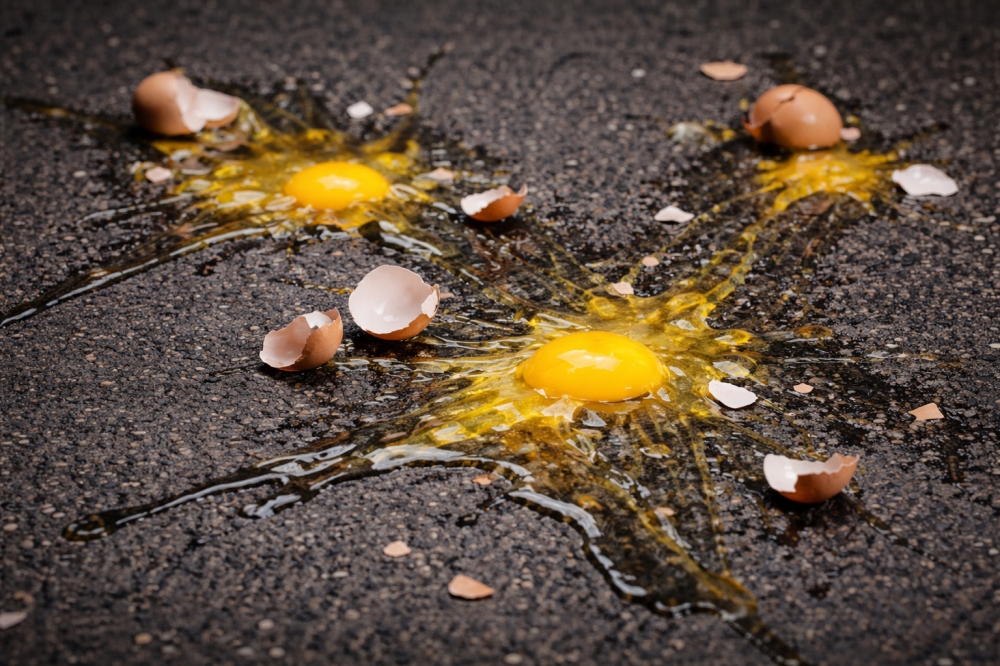 A Singapore man is set to be charged after a string of prank police calls and egg-throwing incidents targeting patrol cars. — AI-generated image