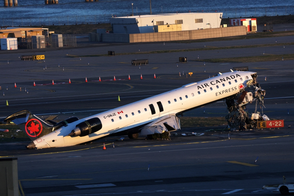 The wreckage of an Air Canada Express jet that collided with a ground vehicle at New York’s LaGuardia Airport in New York March 24, 2026. — Reuters pic