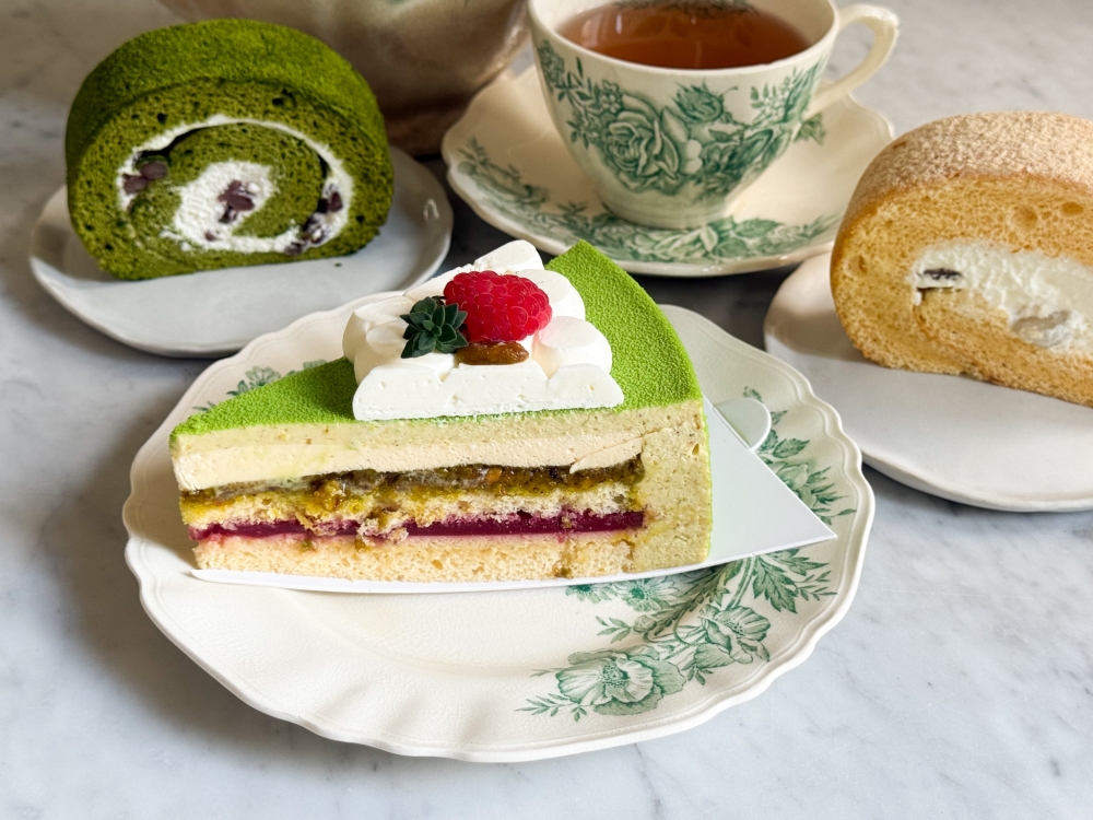 The patisserie's best seller is the Pistachio Cake, featuring eye-catching layers of ground pistachios and fluffy sponge cake. 