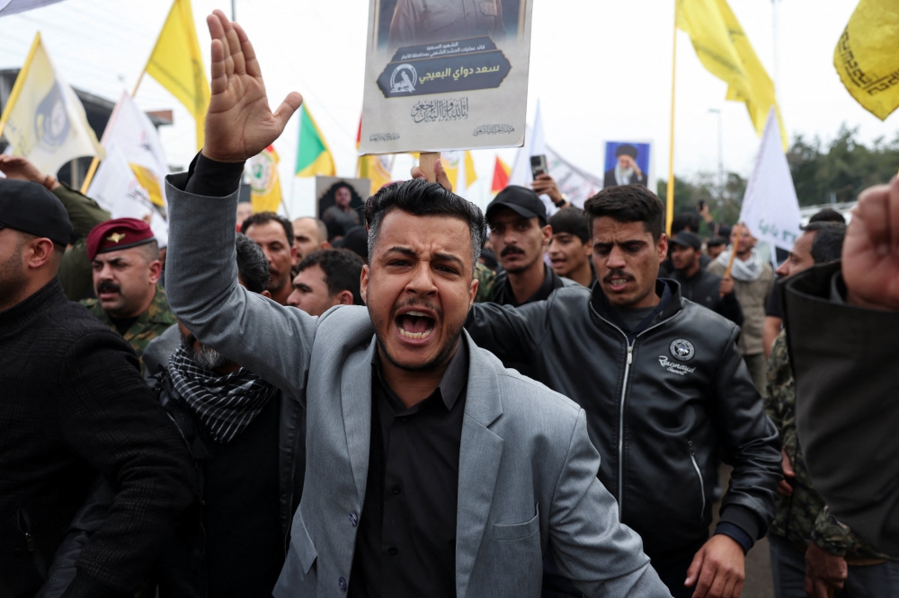 Mourners attend the funeral of Saad al-Baiji, the Popular Mobilisation Forces’ Anbar operations commander, who was killed in airstrikes that targeted a PMF site in Iraq’s western Anbar province, in Baghdad March 24, 2026. — Reuters pic
