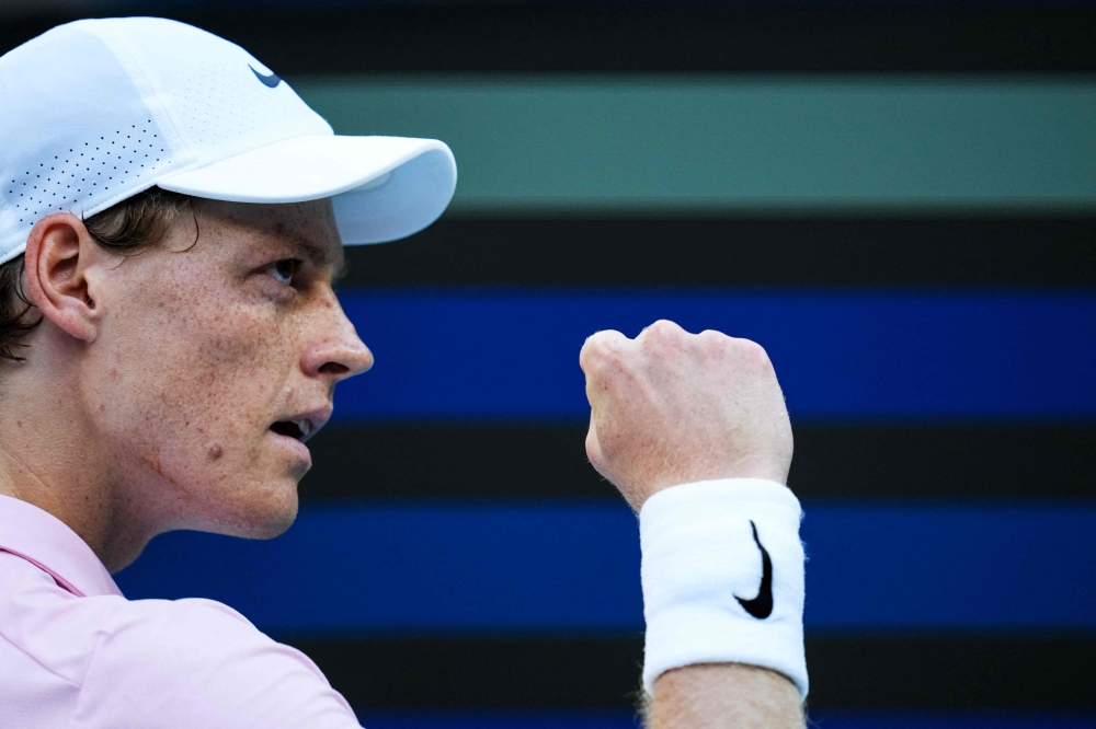Jannik Sinner celebrates after defeating Alex Michelsen to reach the Miami Open quarter-finals. — AFP pic