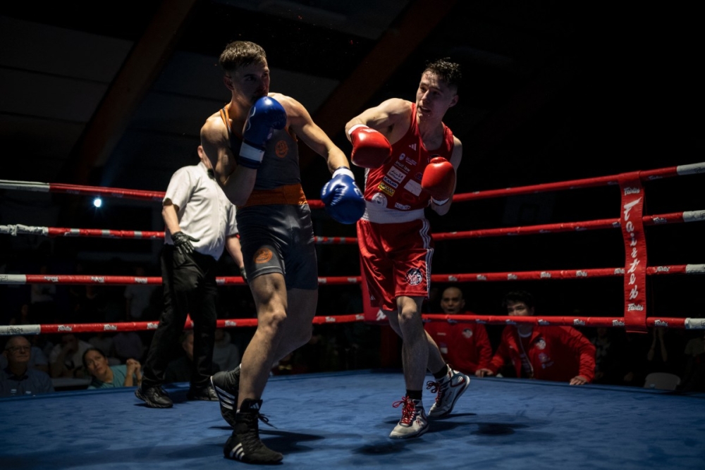 Kian, a member of the local Greenlandic club, lands a punch on his opponent. — AFP pic