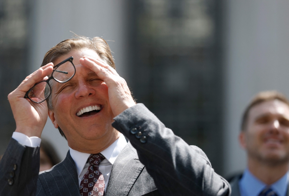 Attorney Mark Lanier, representing plaintiff Kaley G.M., laughs as he speaks to reporters outside of the Los Angeles Superior Court in Los Angeles March 25, 2026. A Los Angeles jury found social media giants Meta and Google liable for designing addictive social media platforms that harmed a young woman’s mental health. — AFP pic
