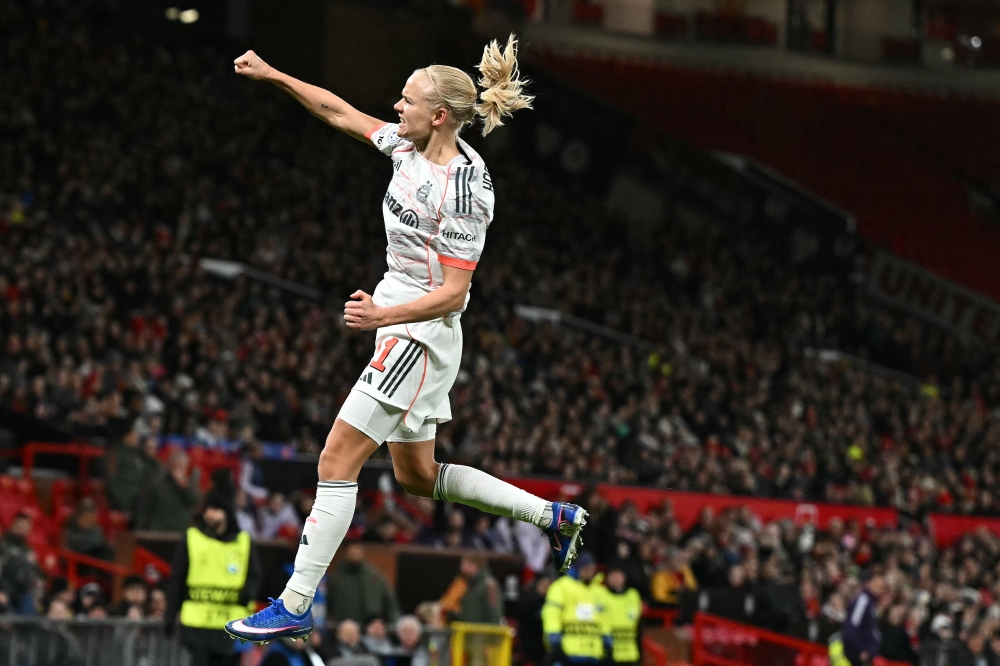 Bayern Munich’s Pernille Harder celebrates after scoring her team’s second goal during the Uefa Women’s Champions League, Quarter Final first-leg match with Manchester United at Old Trafford in Manchester March 25, 2025. — AFP pic