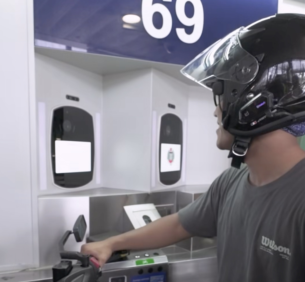 Motorcyclists at Singapore’s land checkpoints will soon use facial recognition alongside QR codes for faster immigration clearance. — Screengrab via Facebook video