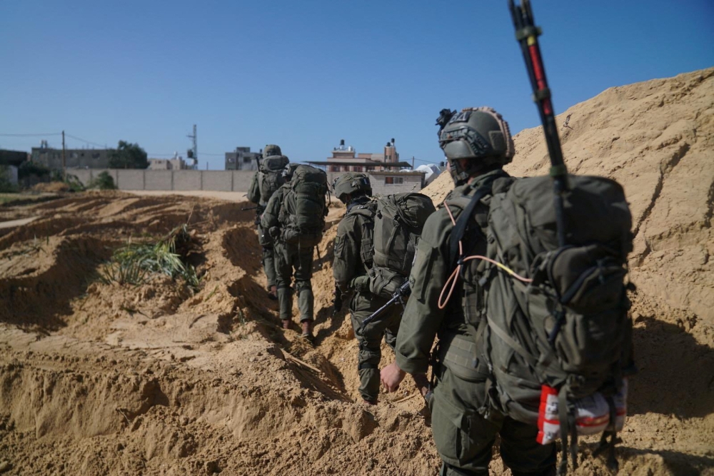 Israeli soldiers operate in the Gaza Strip amid the ongoing conflict between Israel and the Palestinian Islamist group Hamas, in this handout picture released on January 28, 2024. — Israel Defence Forces handout via Reuters pic