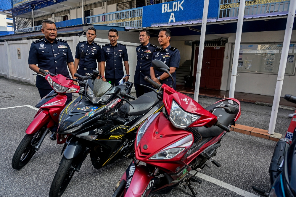 Wangsa Maju District Police Chief SAC Mohammad Lazim Ismail (left) shows seized motorcycles during a press conference on the successful arrest and seizure of the Criminal Investigation Department's Special Operation Lejang Khas in uncovering vehicle theft at Wangsa Maju IPD in Kuala Lumpur March 26, 2026. — Bernama pic