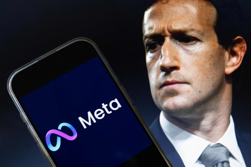 This photo illustration shows an image of Mark Zuckerberg, CEO of Meta, and an image of the Meta logo in Washington, DC on January 7, 2025. — AFP pic