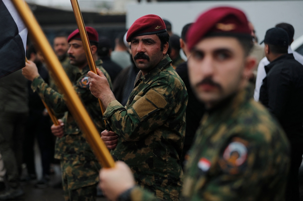 Members of Iraq’s Hashed al-Shaabi take part in the mass funeral of Hashd al-Shaabi operations commander for Al-Anbar, Saad Dawai, and others in Baghdad on March 24, 2026. — AFP pic