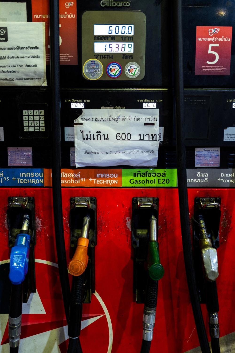 A sign reading ‘Not more than 600 baht (18 USD)’ is posted above fuel nozzles at a gas station, amid the US-Israeli conflict with Iran, in Bangkok March 26, 2026. — Reuters pic