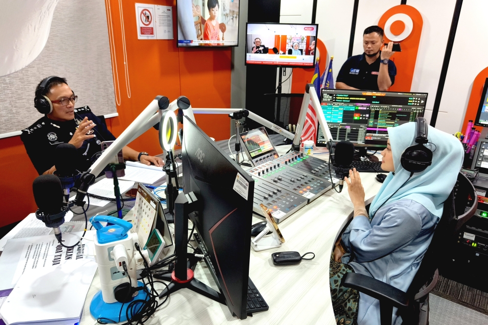Melaka Police Chief Datuk Dzulkhairi Mukhtar (left) being interviewed on the program on Melaka FM in conjunction with the 219th Police Day Celebration March 26, 2026. — Bernama pic