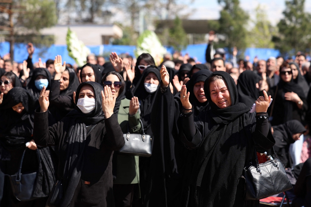 Iranian women mourn during a funeral for victims of the Middle East war at the Behesht Zahra cemetery in southern Tehran on March 26.— AFP pic